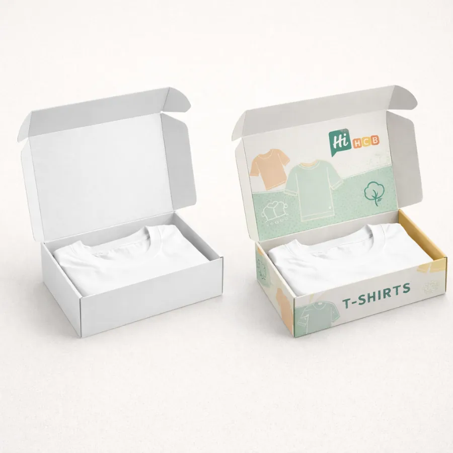 Two cardboard mailer boxes open to reveal folded t-shirts- with vibrant custom printing on one-